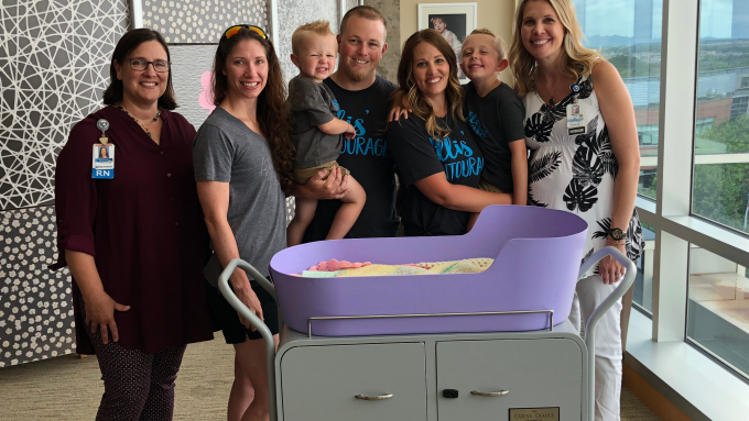 Methodist Employees posing with Caring Cradle device